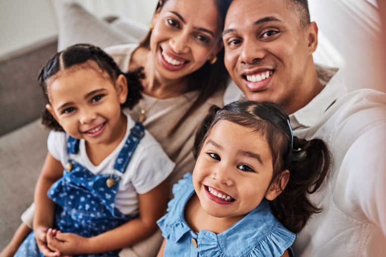 Smile, selfie and portrait of a happy family that love enjoy quality time, relaxing and bonding tog