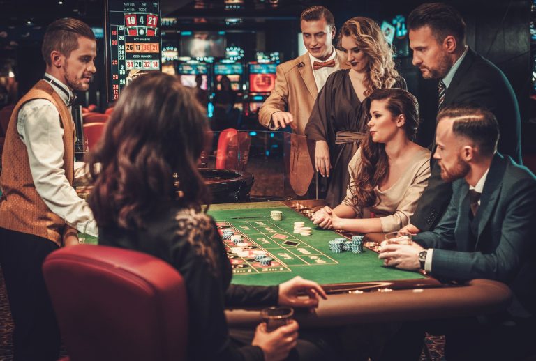 Upper class friends gambling in a casino